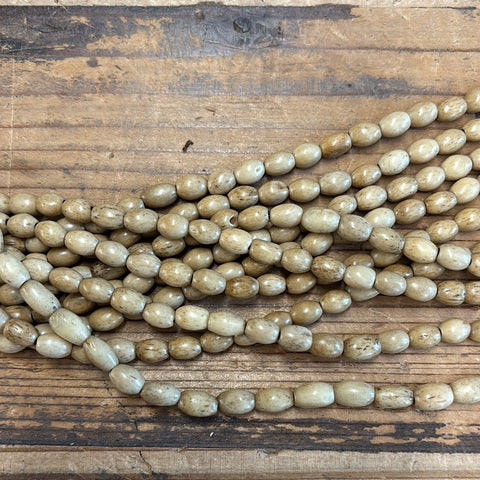 Tan Wood Tubes Strand- about 1/4”